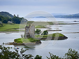 Stalker Castle in Argyle Scotland surrounded by water