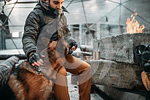 Stalker, post-apocalypse soldier feeding a dog