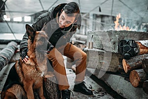 Stalker, post-apocalypse soldier feeding a dog