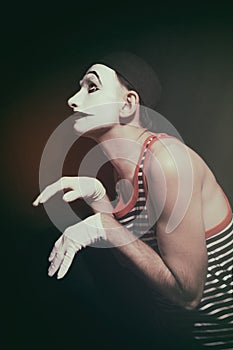 Stalking actor mime on a black background
