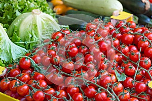 Cherry tomatoes and vegetables, farmer`s market