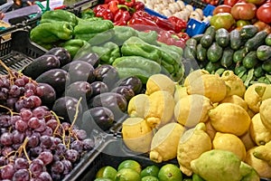 Stall of grapes, lemons, eggplant, mushrooms, pepper, cucumber, tomato at the Graca market in Ponta Delgada, Azores, Portugal