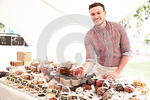 Stall Holder At Farmers Food Market Selling Nuts And Seeds