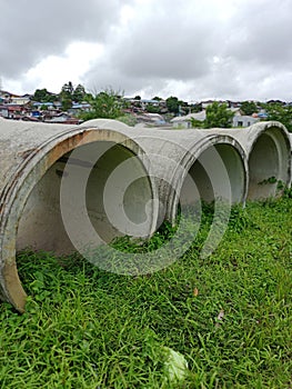 Stalled urban drainage culverts, overgrown with weeds