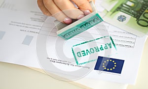 Stamp approved on a document for a visa to Europe