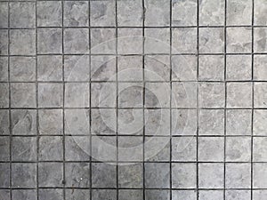 Stamp concrete black color hardener printing patterns on the cement or mortar surface block shape Square pattern material rough photo