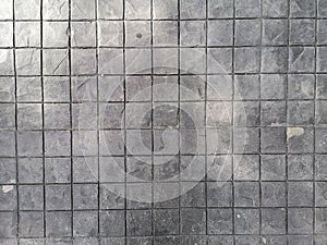 Stamp concrete black color hardener printing patterns on the cement or mortar surface block shape Square pattern material rough