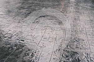 Stamp concrete texture pattern and background, and reflection of sunlight on the floor.