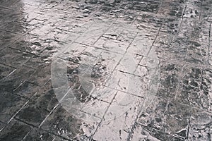 Stamp concrete texture pattern and background, and reflection of sunlight on the floor.