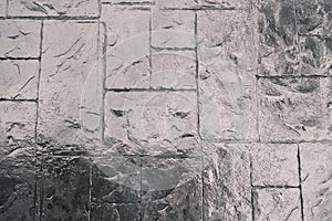 Stamp concrete texture pattern and background, and reflection of sunlight on the floor.