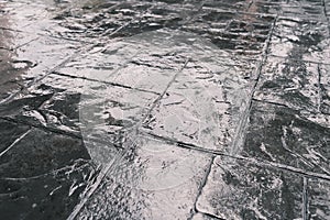 Stamp concrete texture pattern and background, and reflection of sunlight on the floor.