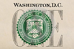 Stamp of the Department of The Treasury on US one dollar bill closeup macro