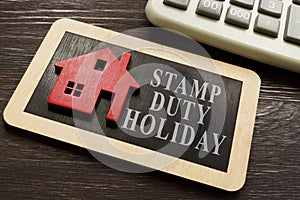 Stamp duty land tax holiday and model of house.
