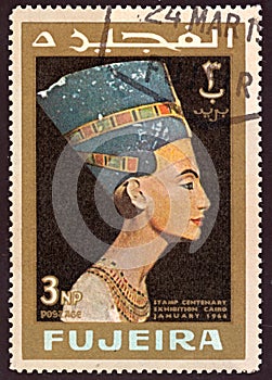 Stamp printed by Fujeira, shows Head staue of Egyptian queen Nefertiti