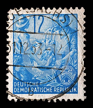 Stamp printed in GDR, shows Farmer, worker, intellectuals