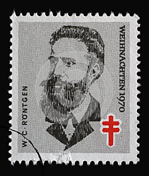 Stamp printed in Germany shows portrait of Wilhelm Conrad RÃÂ¶ntgen, Christmas 1970