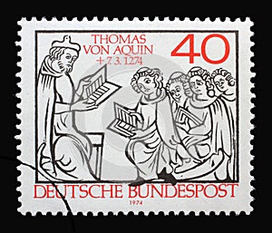 A stamp printed in Germany shows Thomas Aquinas Teaching, 700th Death Anniversary of Thomas Aquinas, scholastic philosopher