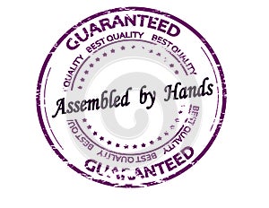 Stamp with text Assembled by hands