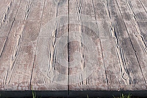 Stamped concrete pavement outdoor, Wooden slats pattern, flooring exterior close up detail photo