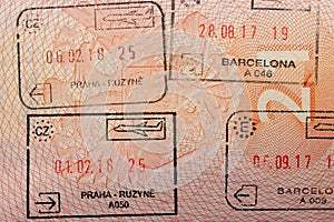 Stamps in a travel passport, entry and exit stamp, emigration, immigration, tourism concept photo