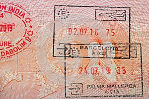 Stamps in a travel passport, entry and exit stamp, emigration, immigration, tourism concept photo