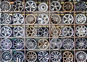 Stand with alloy wheels in tire store