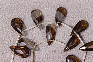 A stand of amber teardrop shaped beads for the creation of jewelry