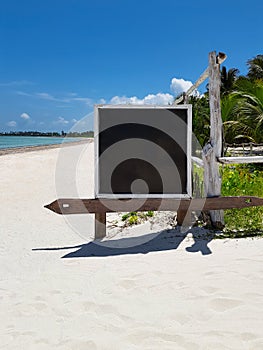 Stand or board for notices on the oken sun beach near the hotel, background