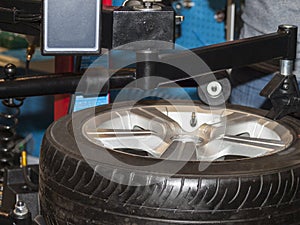 Stand for disassembly and balancing of automobile wheels