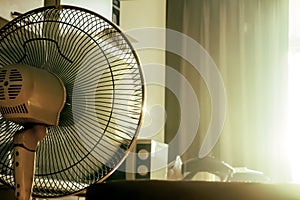 Stand electronic fan in room in morning