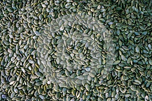 A stand with pumpkin seeds in close-up