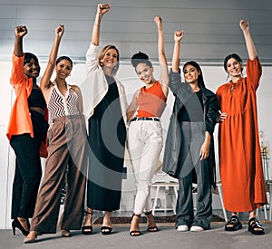 We stand together as women. a group of businesswoman standing in an office at work.