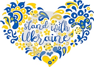 Stand with Ukraine lettering and heart in Ukrainian flag colors and transparent ethnical pattern