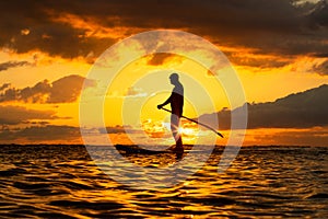 Stand Up Paddle Boarding In Japan During a sunrise and sunset after a typhoon