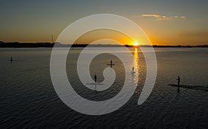 Stand up paddle on Rio Tocantins, during sunset, in Carolina, Maranhao, Brazil.