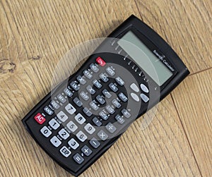 Standaard Scientific calculator on wooden background