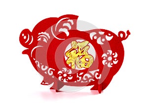 Standable paper-cut on white as symbol of Chinese New Year of the pig the Chinese means good luck