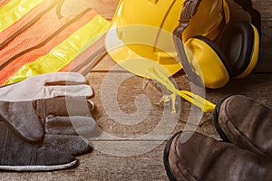 Standard construction safety equipment on wooden table