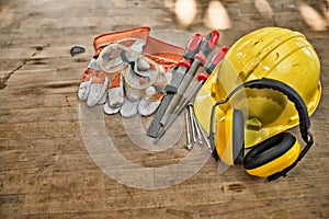 Standard construction safety equipment on wooden table