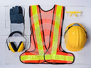 Standard construction safety equipment on wooden table. top view