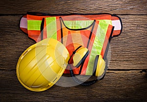 Standard construction safety equipment on wooden table