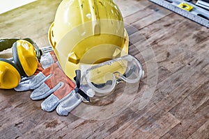 Standard construction safety equipment on wooden table. top view