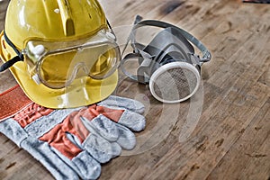 Standard construction safety equipment on wooden table. top view