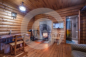 standard design classic wooden russian bath sauna interior with hot stones
