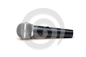 Standard moving-coil dynamic microphone isolated on white