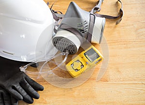 Standard personal protective equipment on wooden table