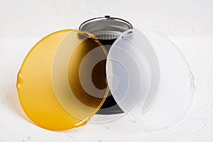 Standard reflector with matt white and yellow diffuser on a white background. Different diffusers for light temperatures.