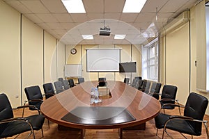 Standard room for presentations and negotiations in the office, long table and chairs