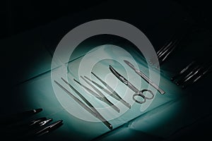 Standard surgical instruments on blue sterilized package in hospital