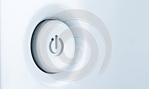 Standby-button on a light blue background.